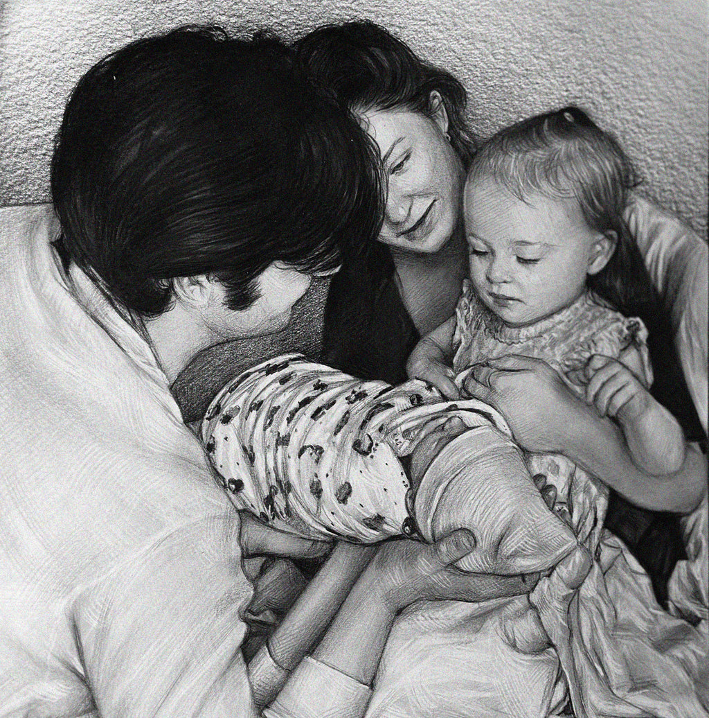 Detailed black and white graphite pencil drawing of a loving family. A father is holding a swaddled newborn baby, while the smiling mother and a young toddler girl look down at the baby affectionately.