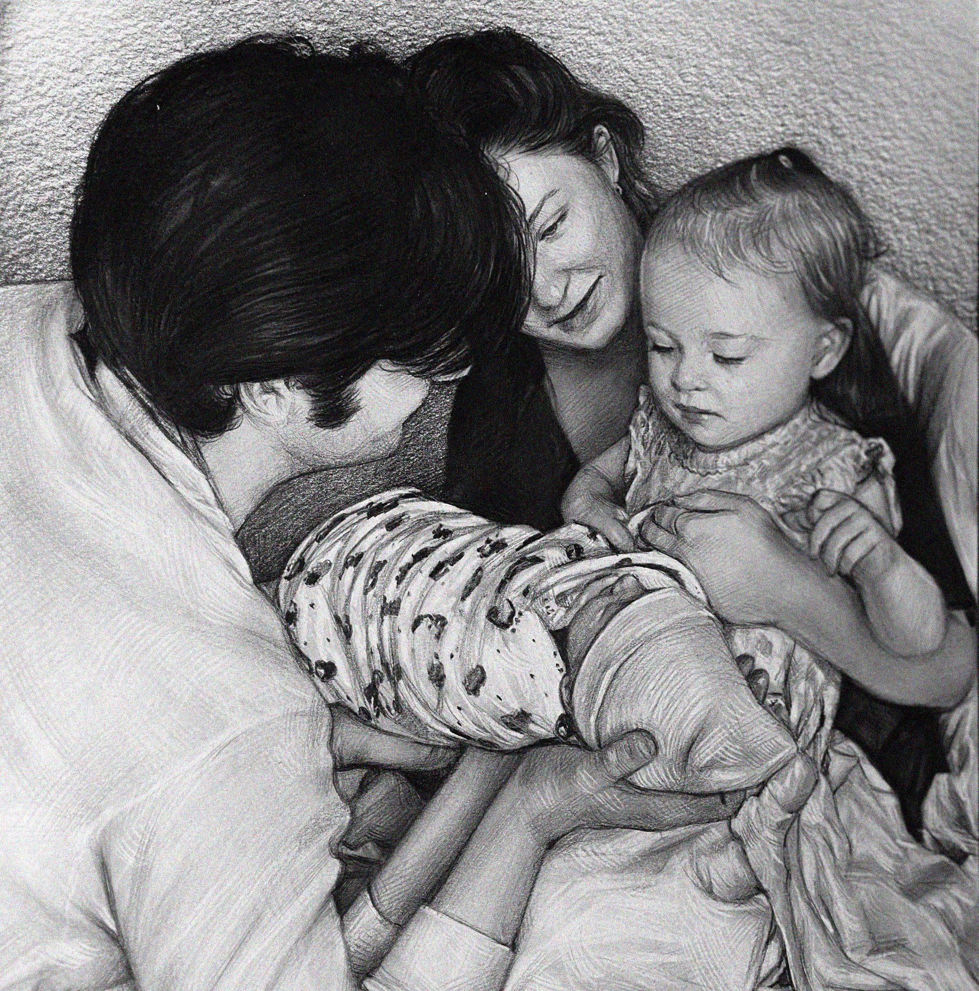 Detailed black and white graphite pencil drawing of a loving family. A father is holding a swaddled newborn baby, while the smiling mother and a young toddler girl look down at the baby affectionately.