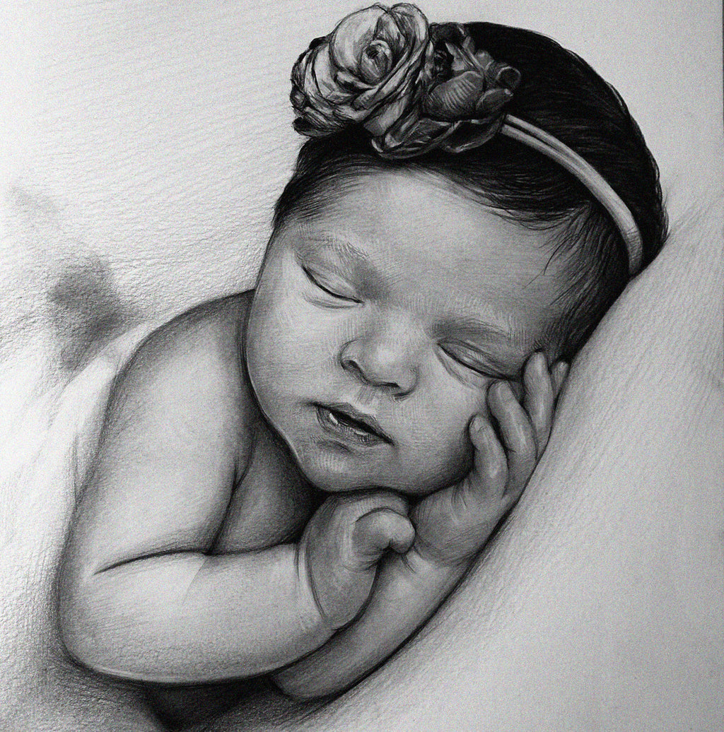 Detailed black and white graphite pencil drawing of a peacefully sleeping newborn baby. The baby is wearing a floral headband and has its tiny hands resting gently against its cheek.