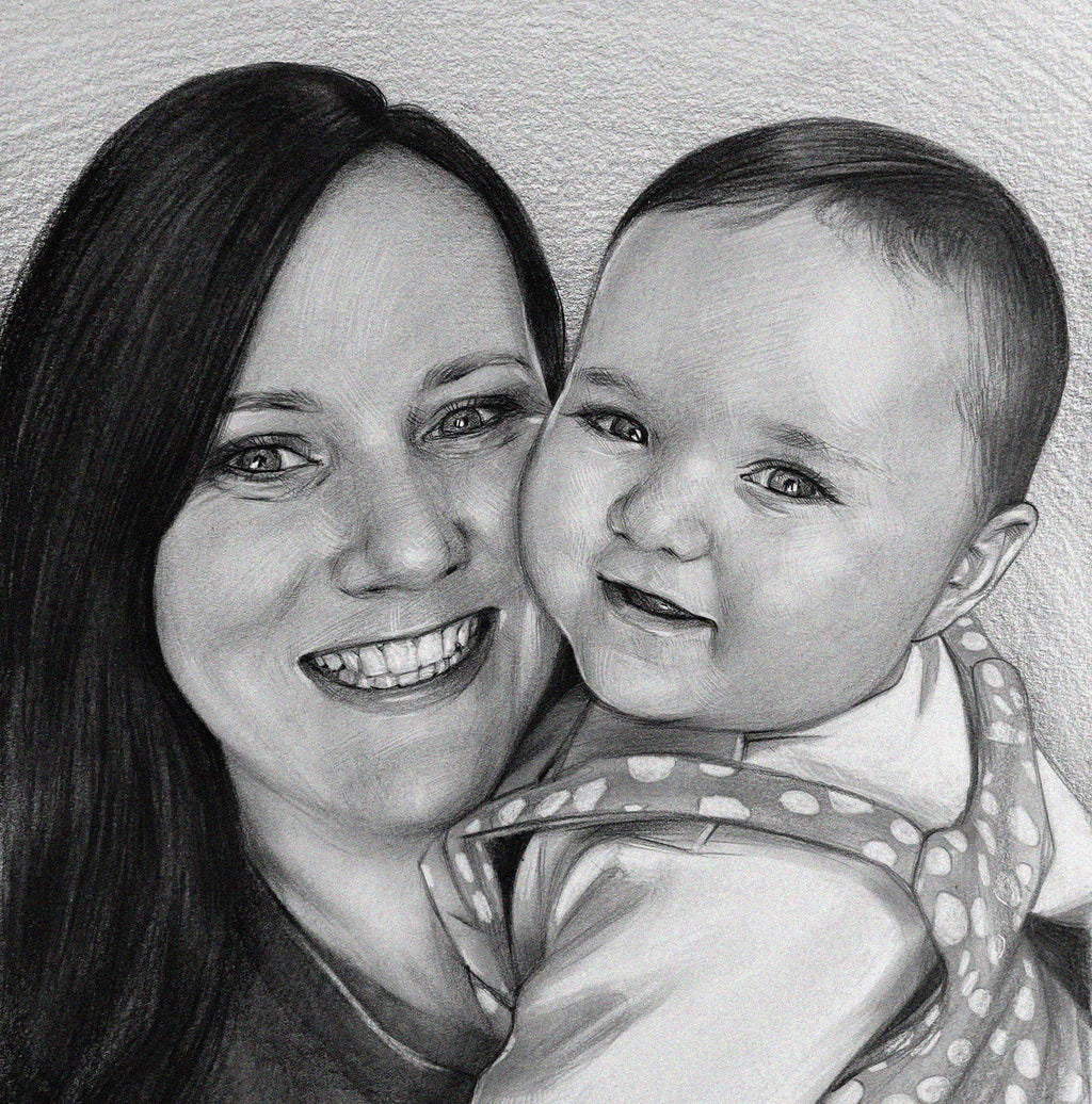 A realistic black-and-white sketch portrait of a woman and a baby, drawn with a graphite pencil. The woman, with long dark hair, is smiling broadly, showing her teeth as she leans her face close to the child. The infant, with sparse hair and large eyes, looks at the viewer with a slight smile, dressed in a spotted onesie. The portrait captures a tender moment and the details of the paper’s texture and pencil hatching.